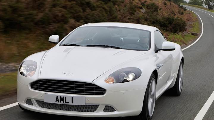 Running Front Pose Of 2010 Aston Martin DB9 In White